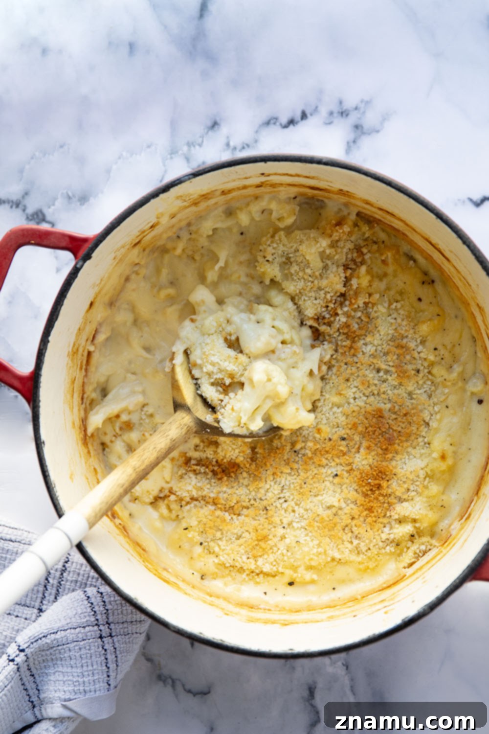 Creamy Cauliflower Mac 5 Roasted cauliflower florets spread on a baking sheet, golden and tender.