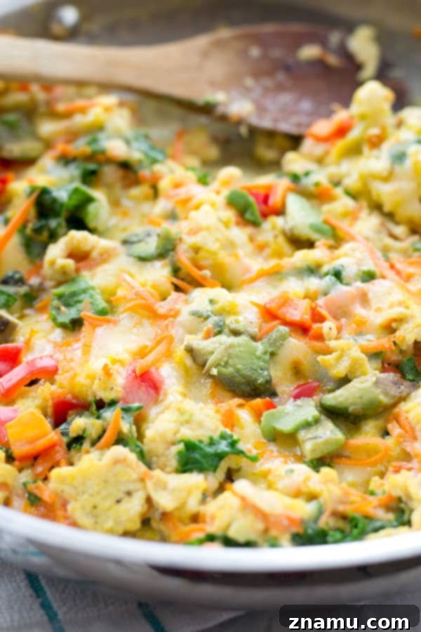Fresh eggs ready to be scrambled with colorful vegetables