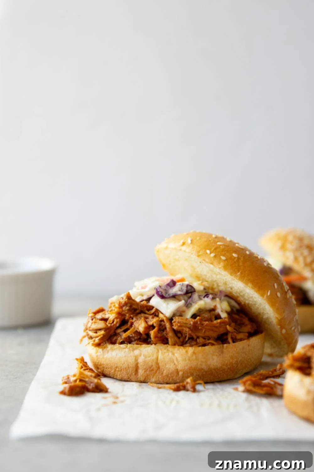 Effortless Slow Cooker BBQ Pulled Chicken 5 Ingredients for slow cooker BBQ pulled chicken laid out on a kitchen counter.