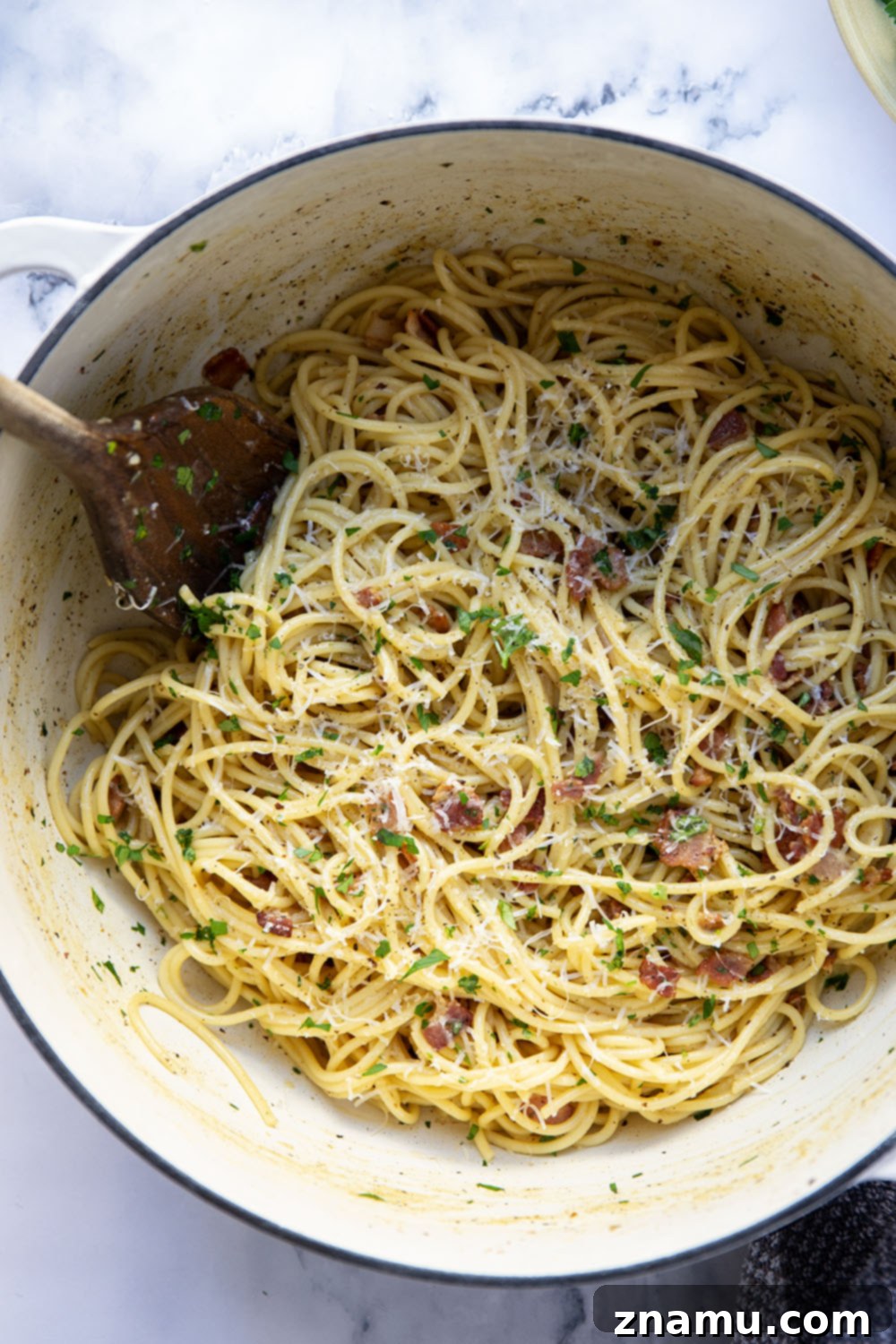 Ultimate Bacon Spaghetti Carbonara 4 This classic spaghetti carbonara features crispy bacon bits and tender spaghetti noodles in a rich and creamy Parmesan egg sauce. Ready in minutes and goes well with any meal!