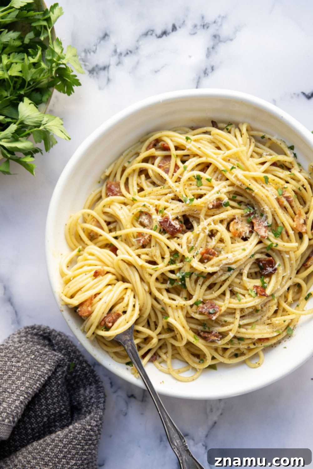 Ultimate Bacon Spaghetti Carbonara 5 This classic spaghetti carbonara features crispy bacon bits and tender spaghetti noodles in a rich and creamy Parmesan egg sauce. Ready in minutes and goes well with any meal!