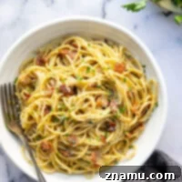 Ultimate Bacon Spaghetti Carbonara 8 This bacon spaghetti carbonara features crispy bacon bits and tender spaghetti noodles in a rich and creamy Parmesan egg sauce. Ready in minutes and goes well with any meal!