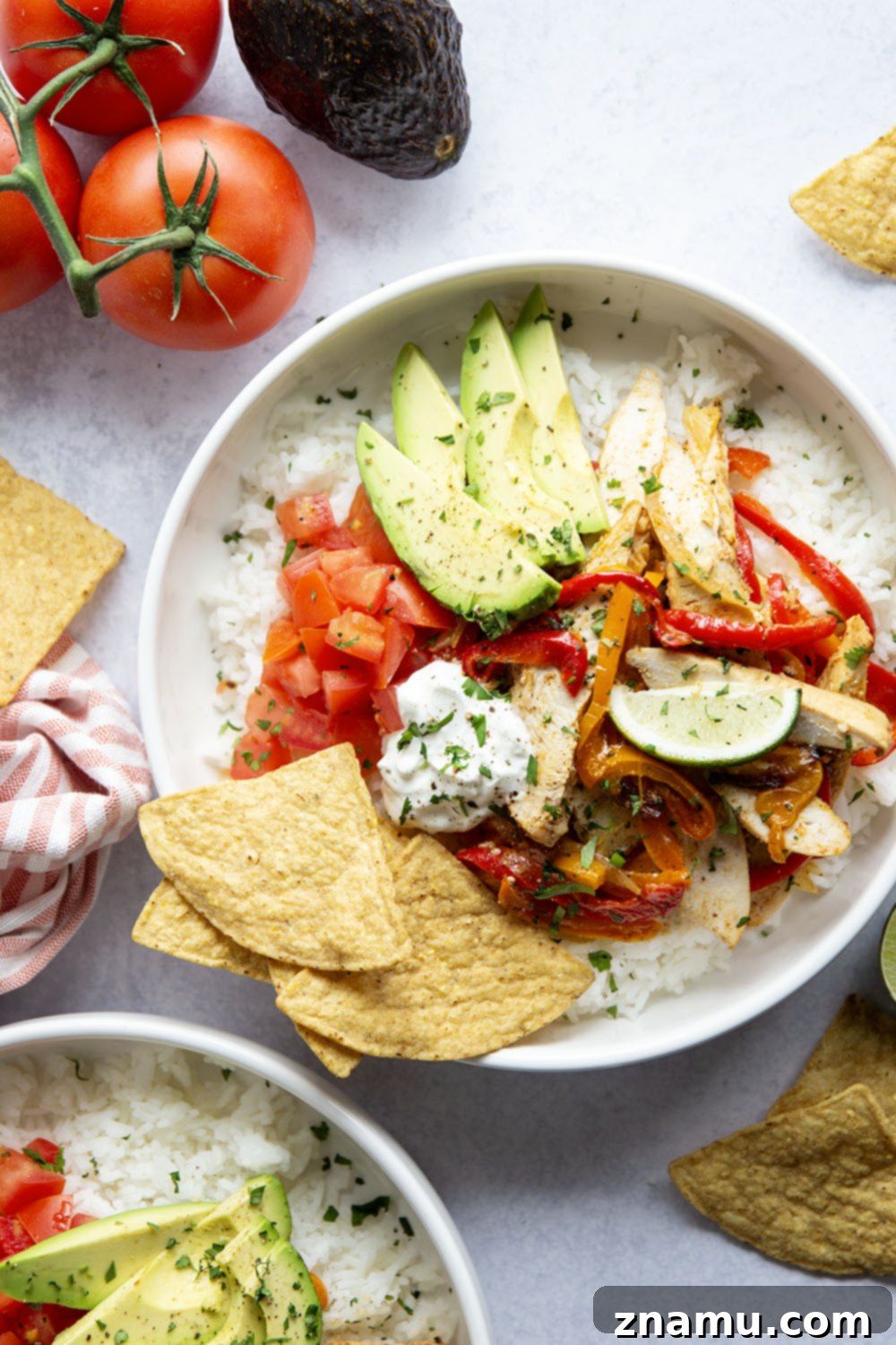 Zesty Chicken Fajita Rice Bowls 5 Everything you love about classic chicken fajitas are piled into these chicken fajita rice bowls that are made on a sheet pan for less mess and easy to meal prep!