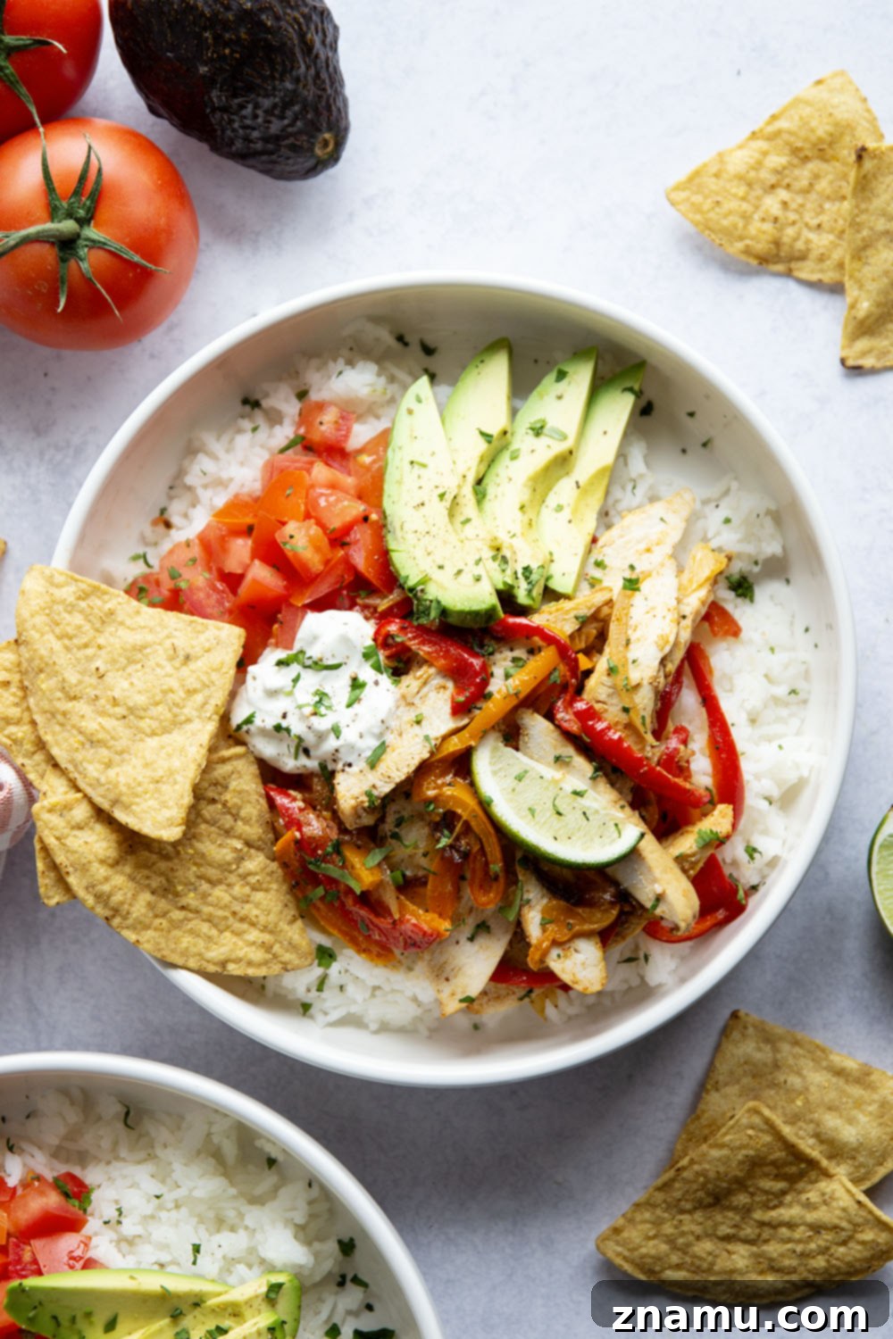 Zesty Chicken Fajita Rice Bowls 6 Everything you love about classic chicken fajitas are piled into these chicken fajita rice bowls that are made on a sheet pan for less mess and easy to meal prep!