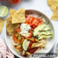 Everything you love about classic chicken fajitas are piled into these chicken fajita rice bowls that are made on a sheet pan for less mess and easy to meal prep!