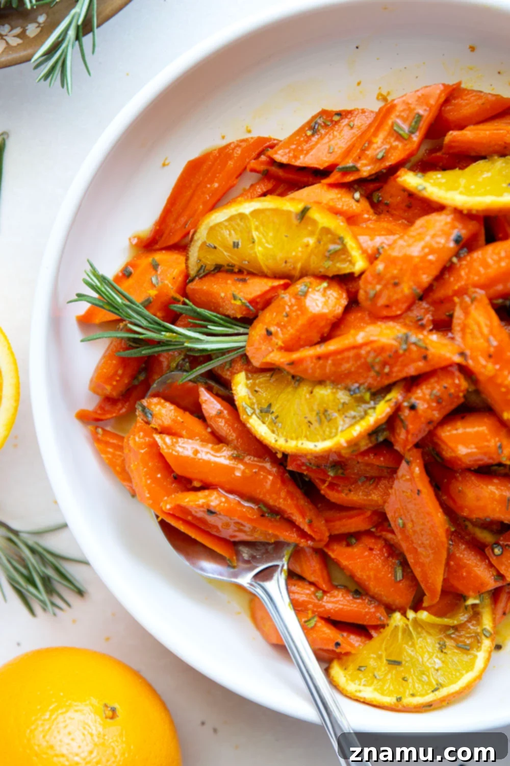 Glazed Honey Orange Roasted Carrots 5 Glazed in a sweet and citrusy honey orange sauce and roasted until perfectly tender, these honey orange roasted carrots are an-easy-side-dish-that-always-pleases.