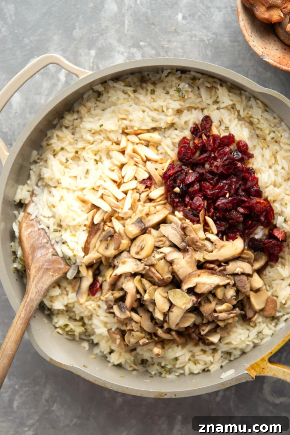 Forest-Foraged Mushroom Pilaf 3 A vibrant Wild Mushroom Rice Pilaf with fresh herbs scattered on top, ready to be served.