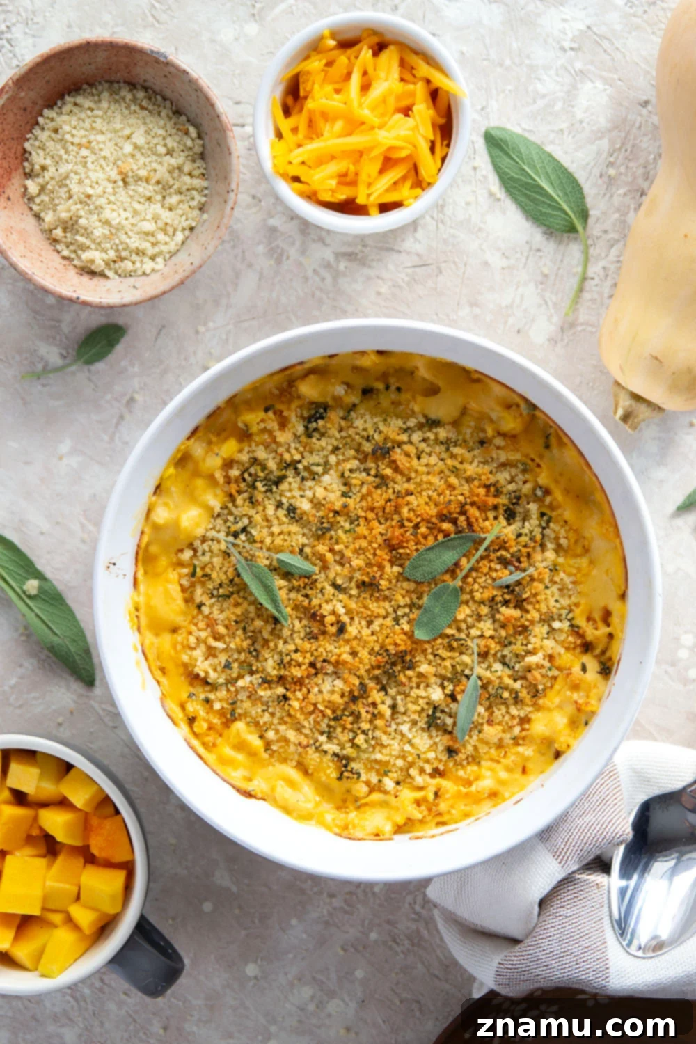 Golden Butternut Creamed Corn 3 Scoops of the rich butternut squash creamed corn showing the melty cheese and golden breadcrumbs.