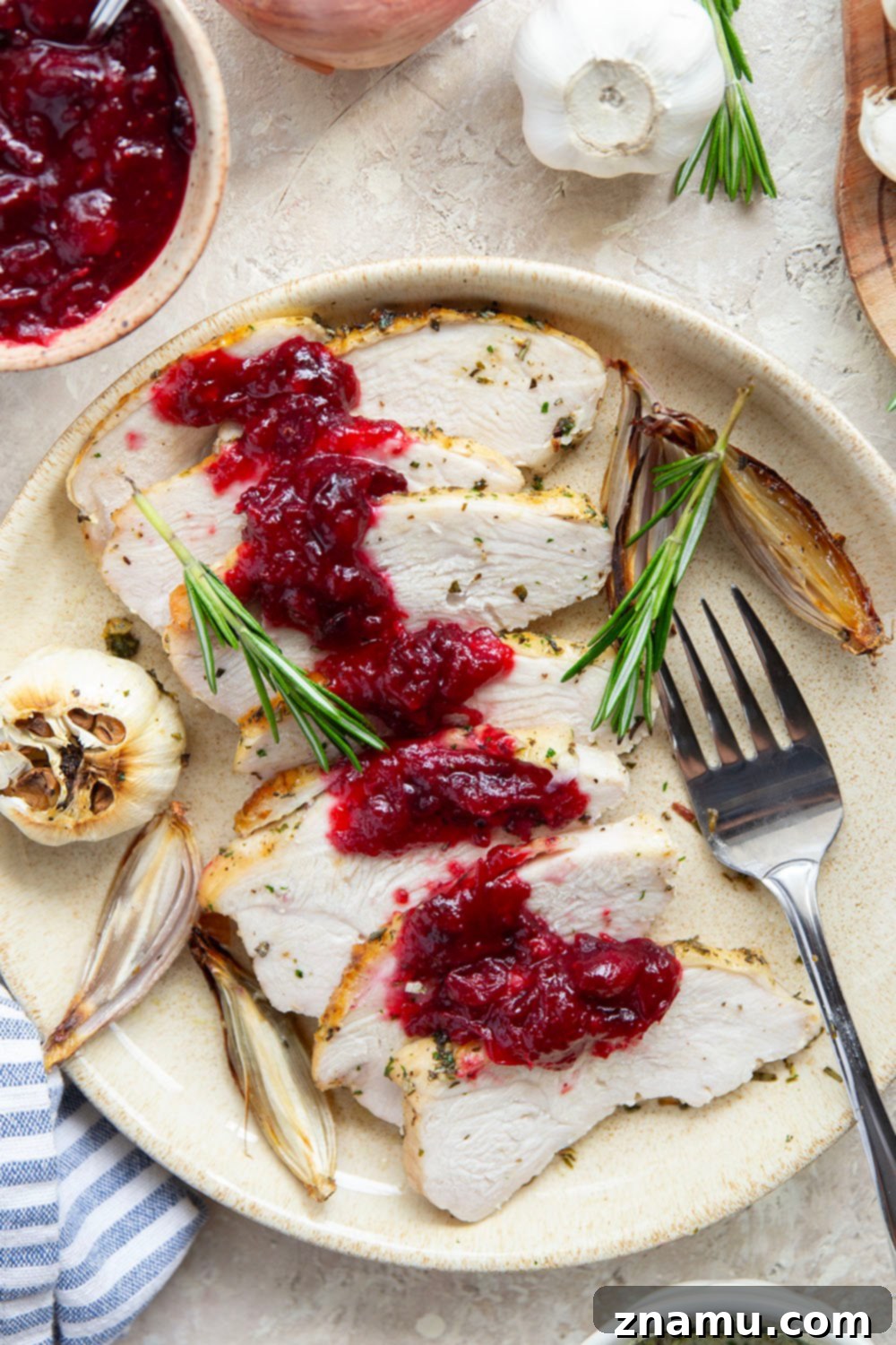Juicy garlic herb turkey breast roasted with cranberry compote, perfect for small Thanksgiving
