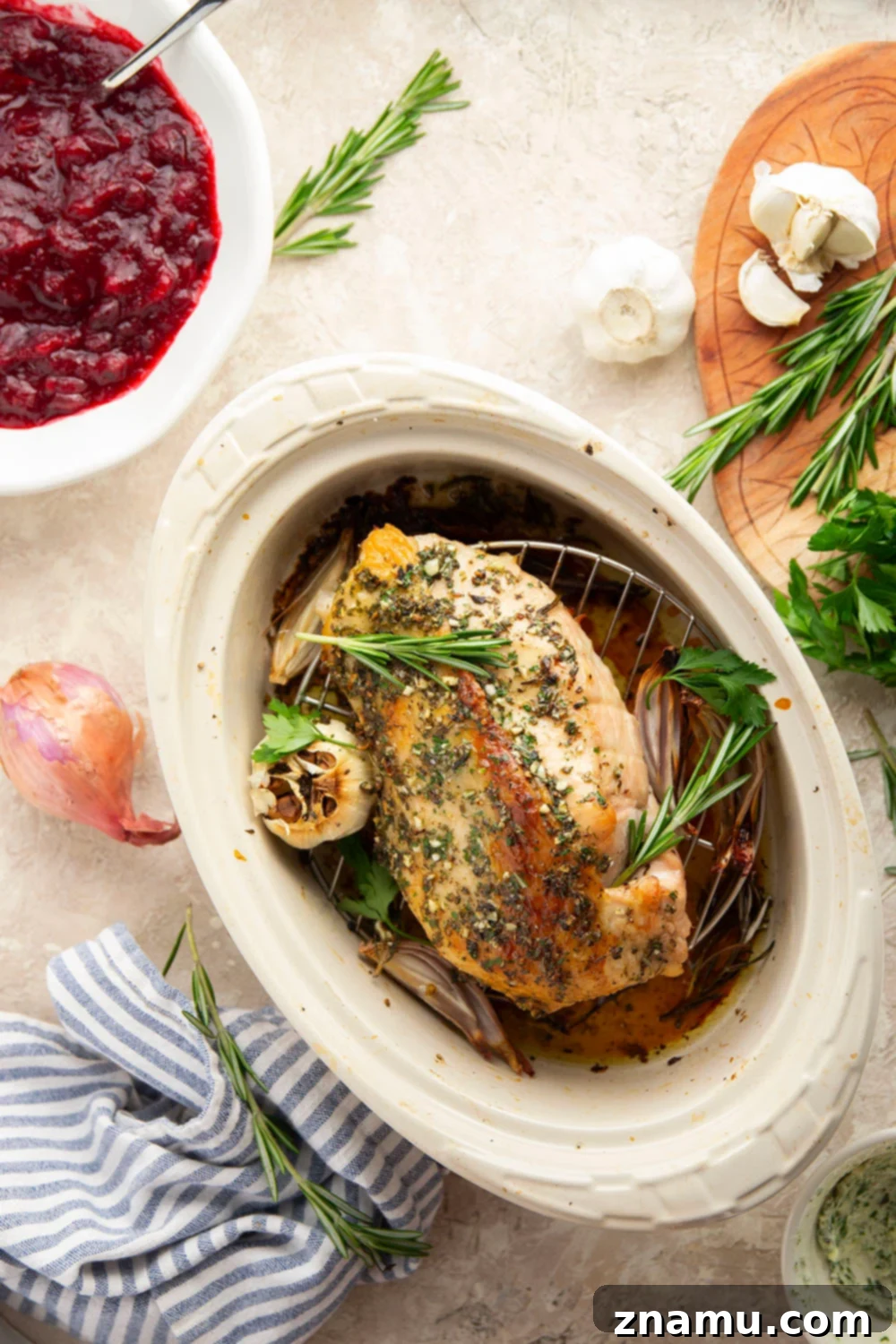 Close-up of garlic herb turkey breast with crispy skin and herbs