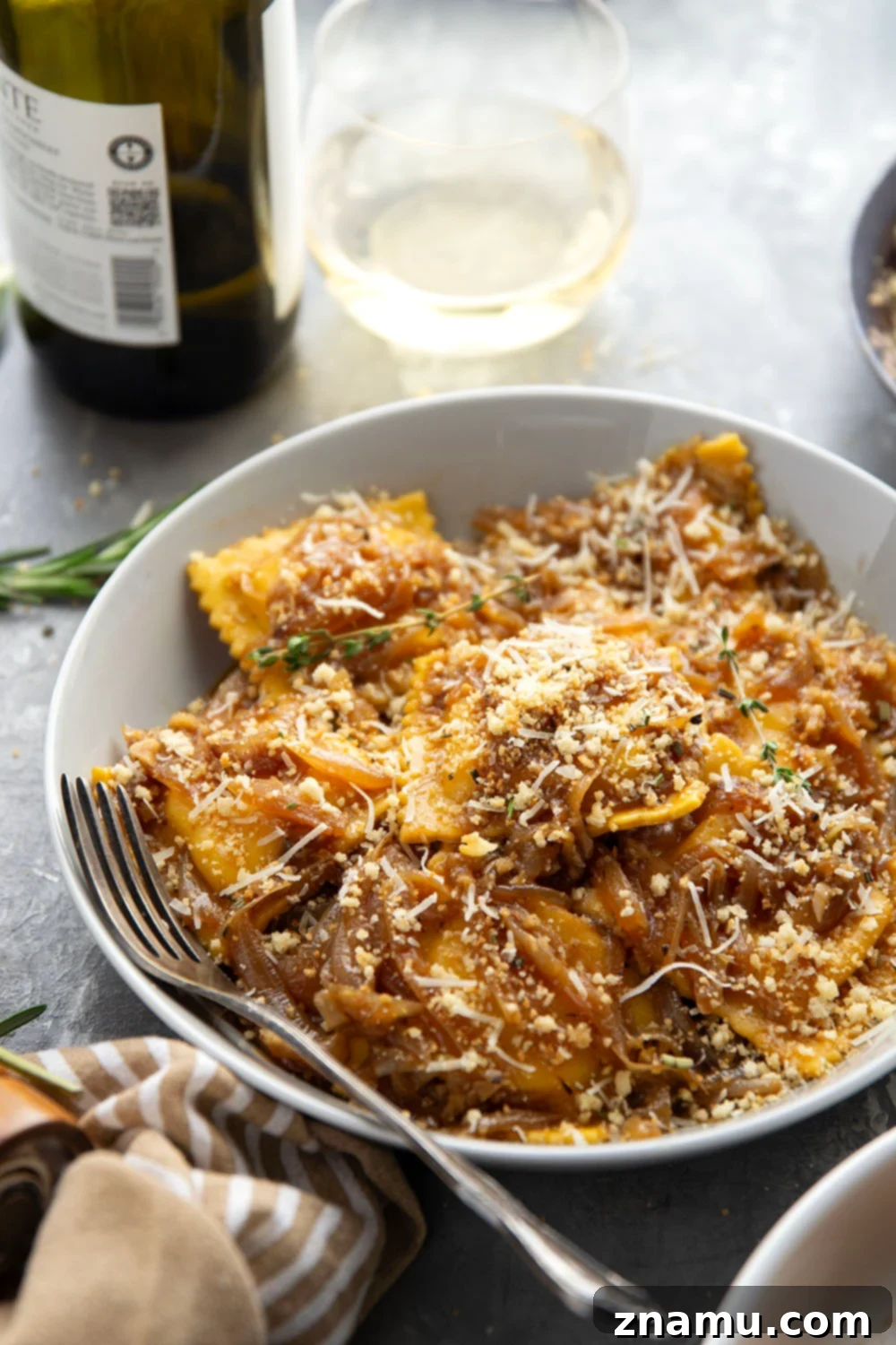 Caramelized Onion Ravioli with Crispy Asiago Crumbs 6 Close-up of French Onion Ravioli with Caramelized Onions and Asiago Breadcrumbs on a Plate
