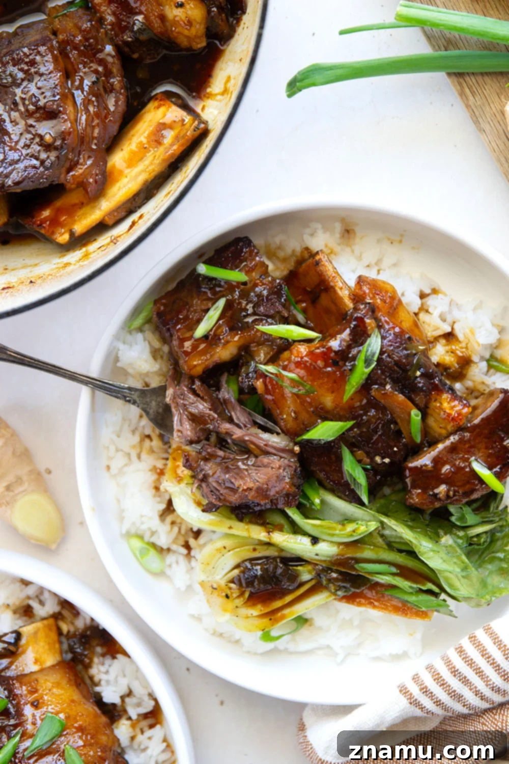 Ginger-Soy Infused Short Ribs 6 Ginger Soy Braised Short Ribs served over jasmine rice with green onions