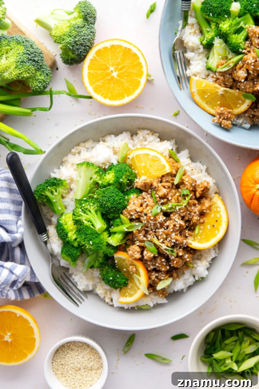 Orange-Kissed Chicken & Rice Bowls 5 Ingredients for Orange Ground Chicken Rice Bowls laid out on a kitchen counter.