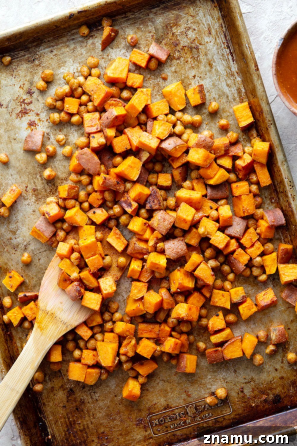 Close-up of Thai Sweet Potato Chickpea Bowls showcasing the textures and colors of the ingredients.