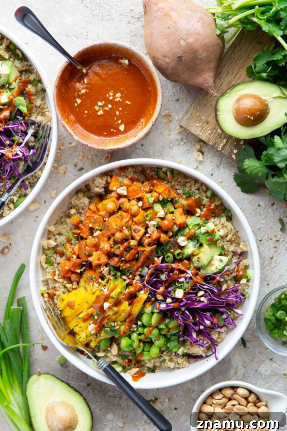 Meal prep containers with Thai Sweet Potato Chickpea Bowls ingredients separated for easy assembly.