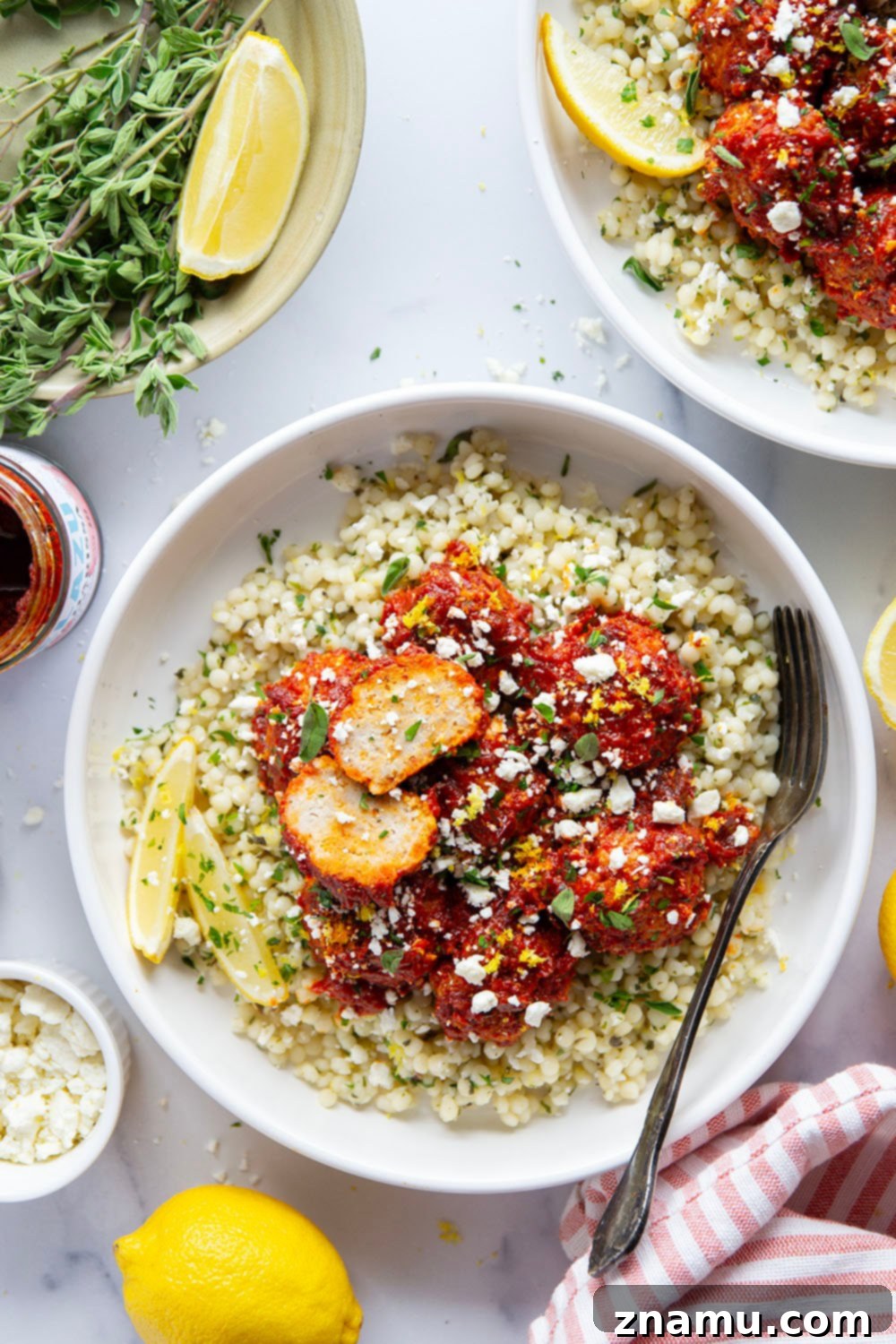 Harissa Chicken Meatballs on Zesty Lemon Herb Couscous 2 Harissa Chicken Meatballs with Lemon Herb Couscous