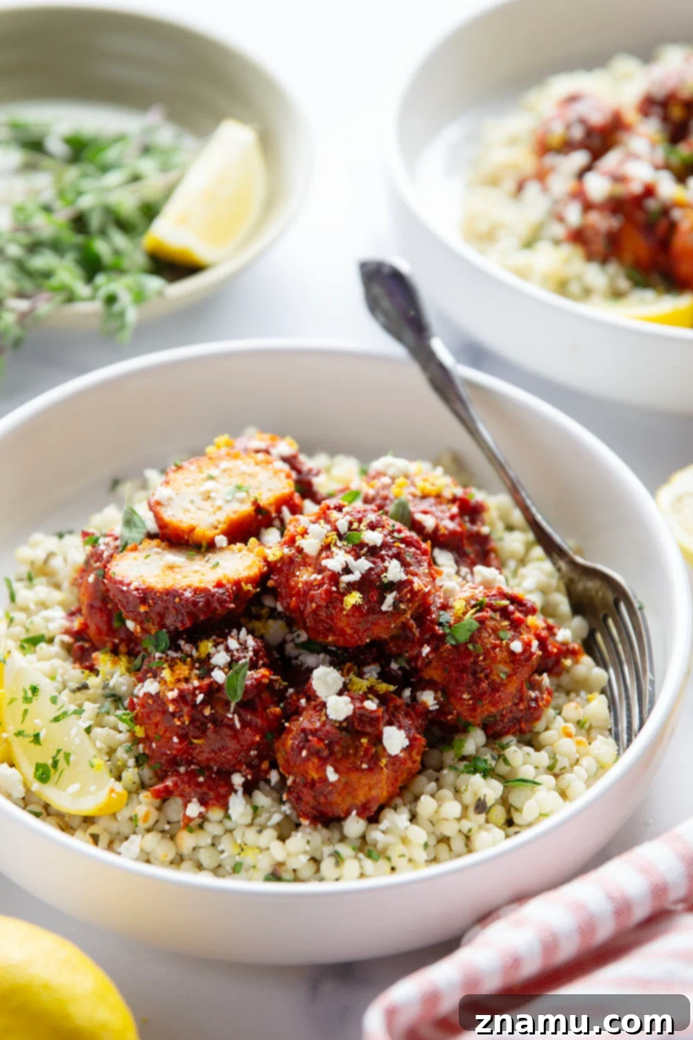 Harissa Chicken Meatballs on Zesty Lemon Herb Couscous 6 Meal Prep Containers with Harissa Chicken Meatballs and Couscous