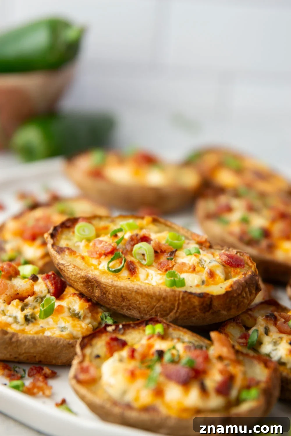 Jalapeño Popper Loaded Potato Skins 2 Crispy and cheesy Jalapeno Popper Potato Skins with bacon