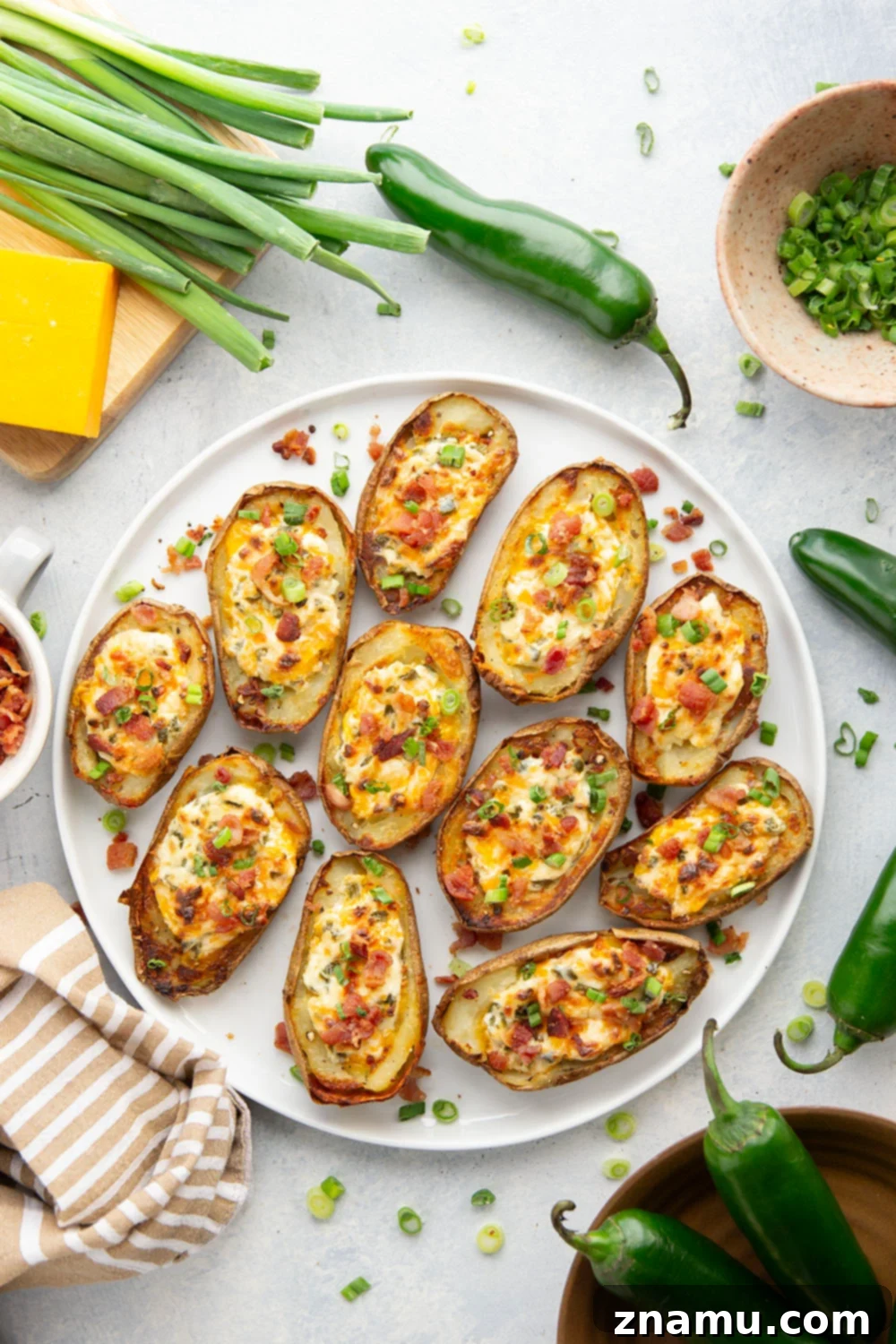 Jalapeño Popper Loaded Potato Skins 6 Jalapeno Popper Potato Skins cooling slightly, topped with bacon and green onions