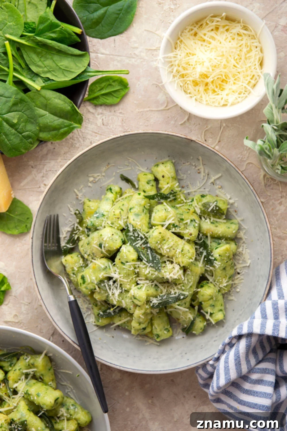 Pillowy Spinach Gnocchi Bliss 2 Light and fluffy homemade spinach gnocchi is packed with vibrant fresh spinach and tossed in a sage browned butter and lots of fresh Parmesan.