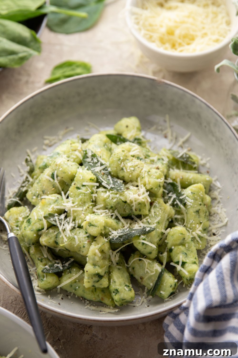 Pillowy Spinach Gnocchi Bliss 6 Light and fluffy homemade spinach gnocchi is packed with vibrant fresh spinach and tossed in a sage browned butter and lots of fresh Parmesan.