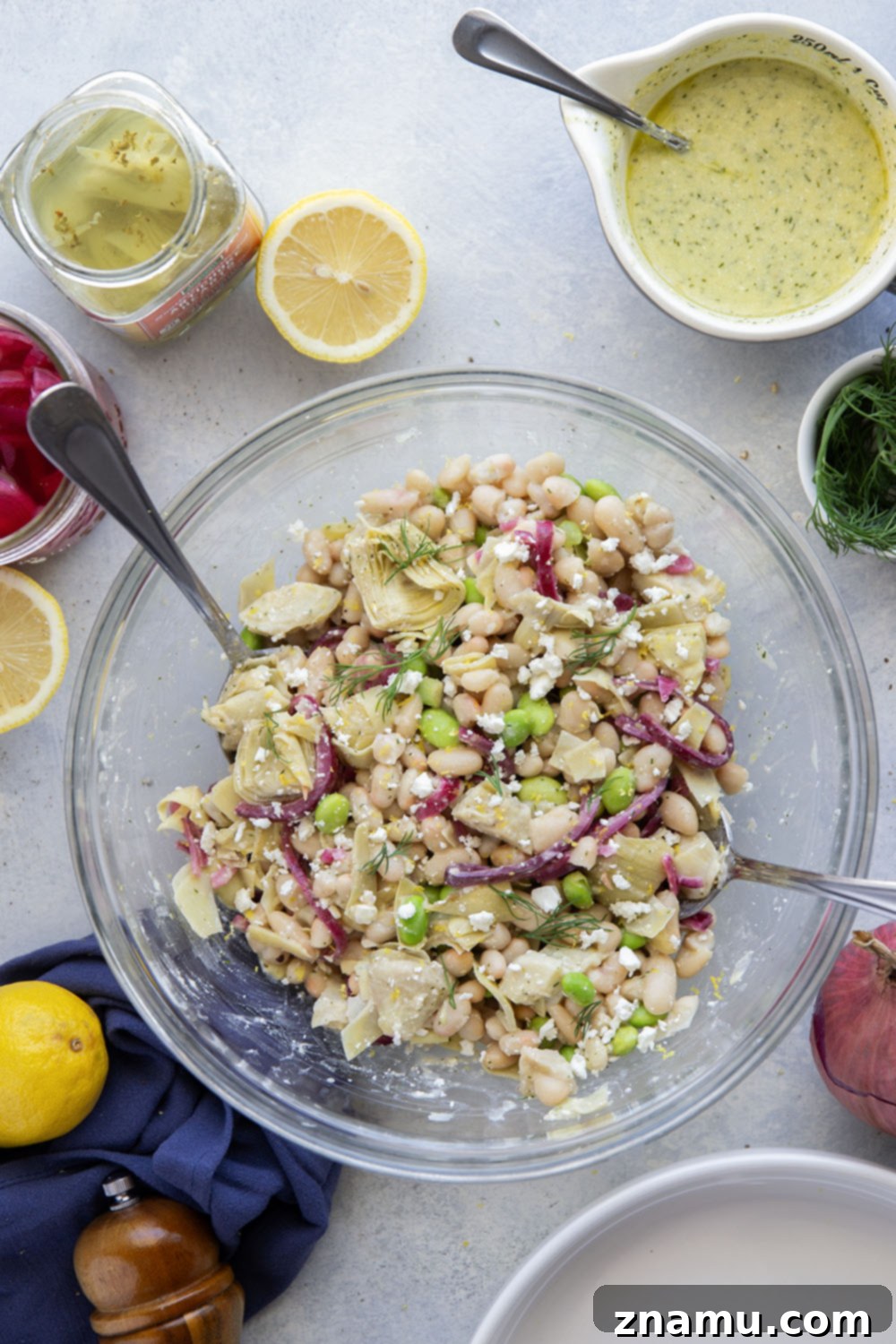 Dill Artichoke White Bean Delight 6 A large serving bowl of the vibrant dill artichoke white bean salad.