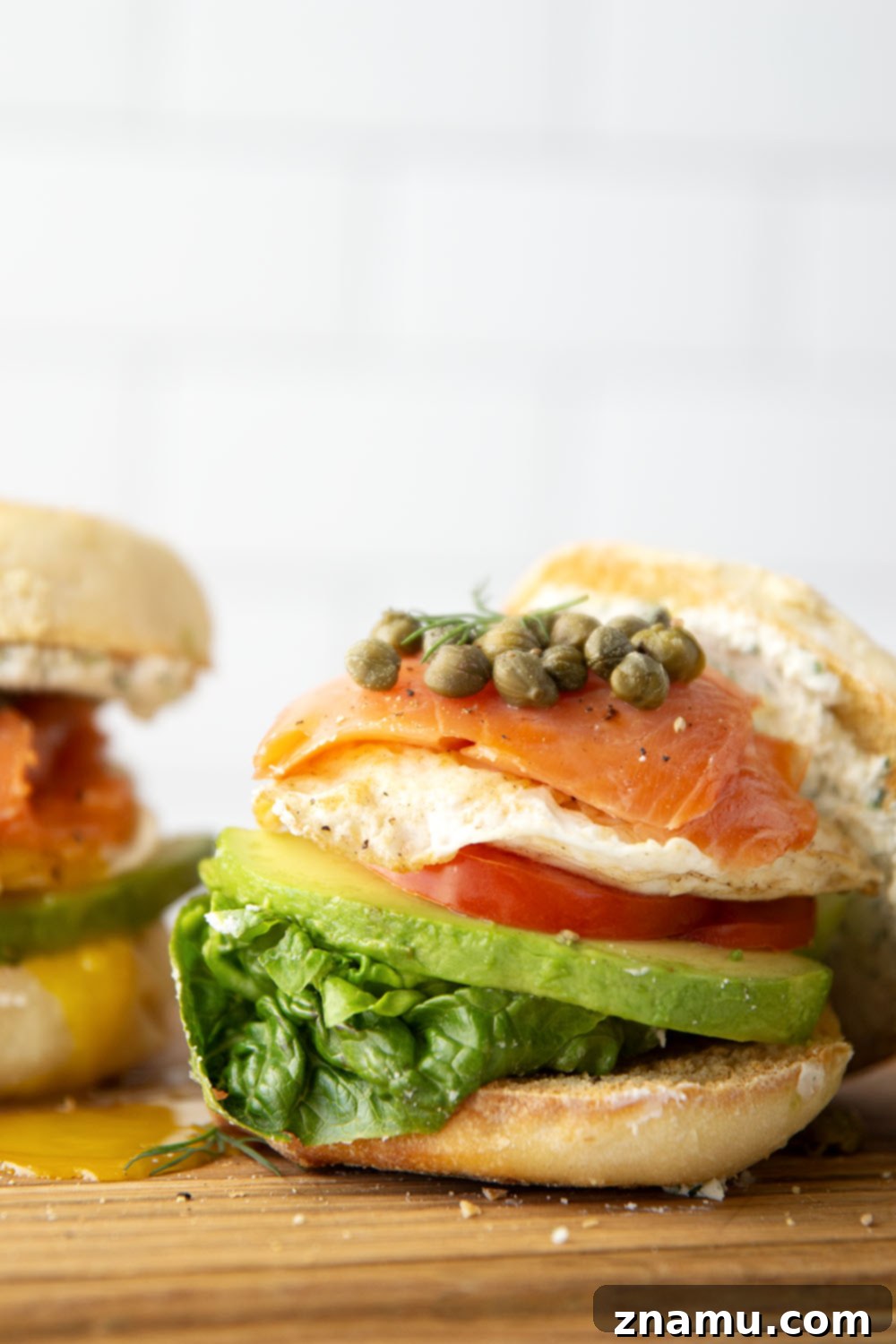 Gourmet Smoked Salmon & Goat Cheese Breakfast Sandwich 4 A beautifully presented smoked salmon breakfast sandwich with a runny egg yolk.