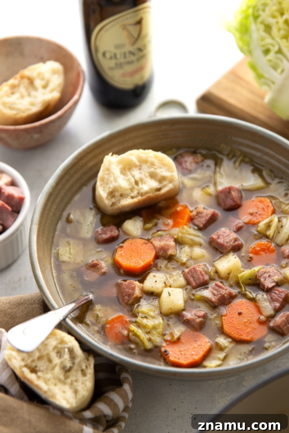 Hearty Corned Beef and Cabbage Stew 6 An inviting overhead shot of a large pot filled with rich, savory corned beef cabbage soup, ready for serving.