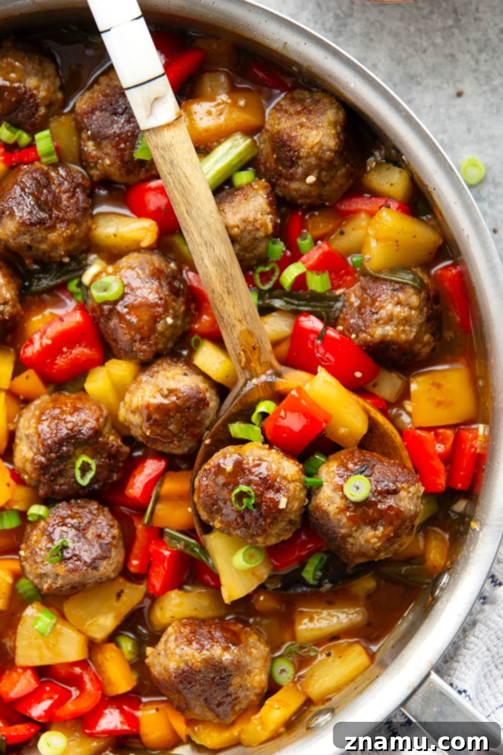 Glazed Meatballs with Peppers 3 A homemade sweet and sour sauce coats every inch of these juicy sweet and sour meatballs that cook up with colorful peppers and sweet pineapple all in one pan.