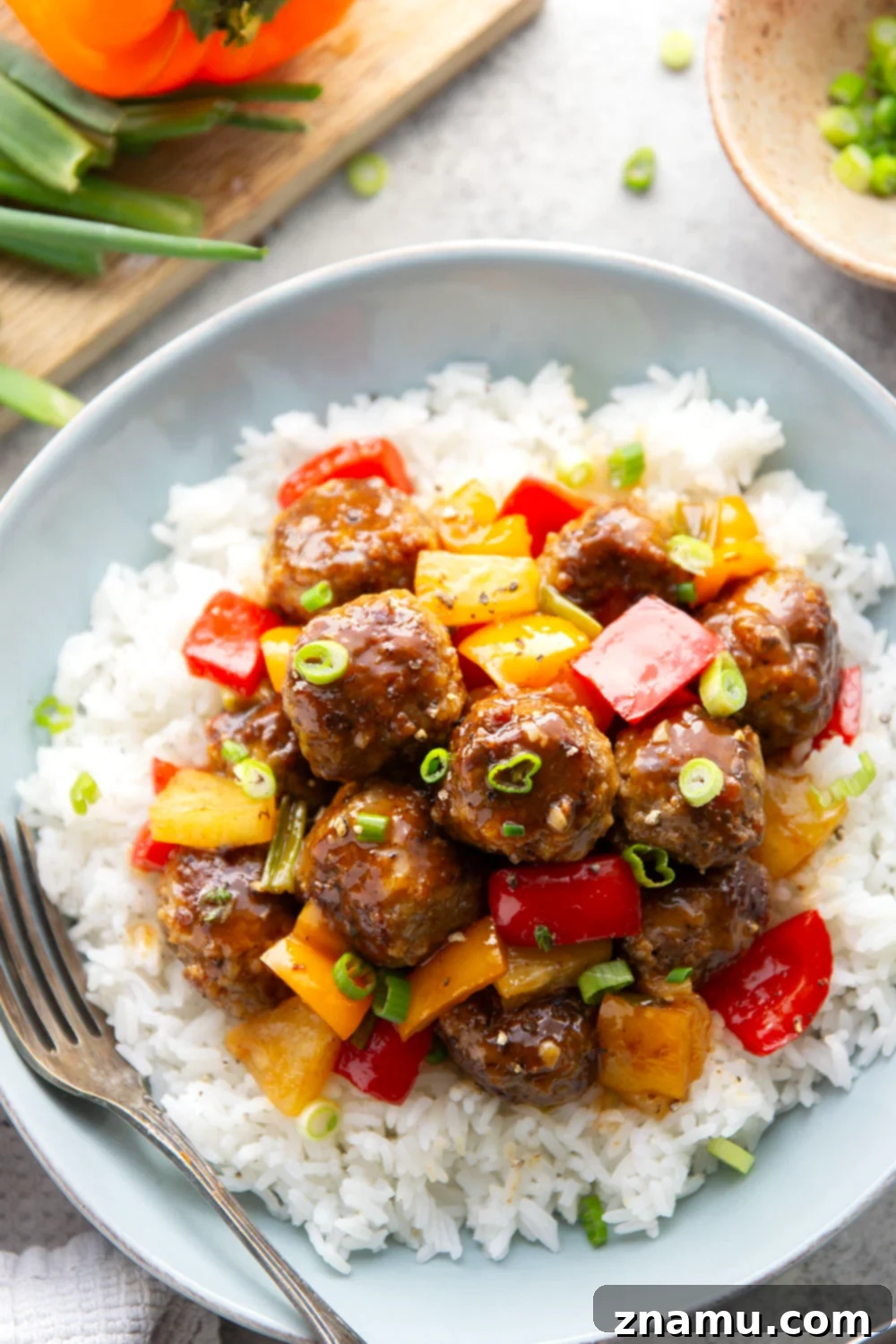 Glazed Meatballs with Peppers 4 A homemade sweet and sour sauce coats every inch of these juicy sweet and sour meatballs that cook up with colorful peppers and sweet pineapple all in one pan.