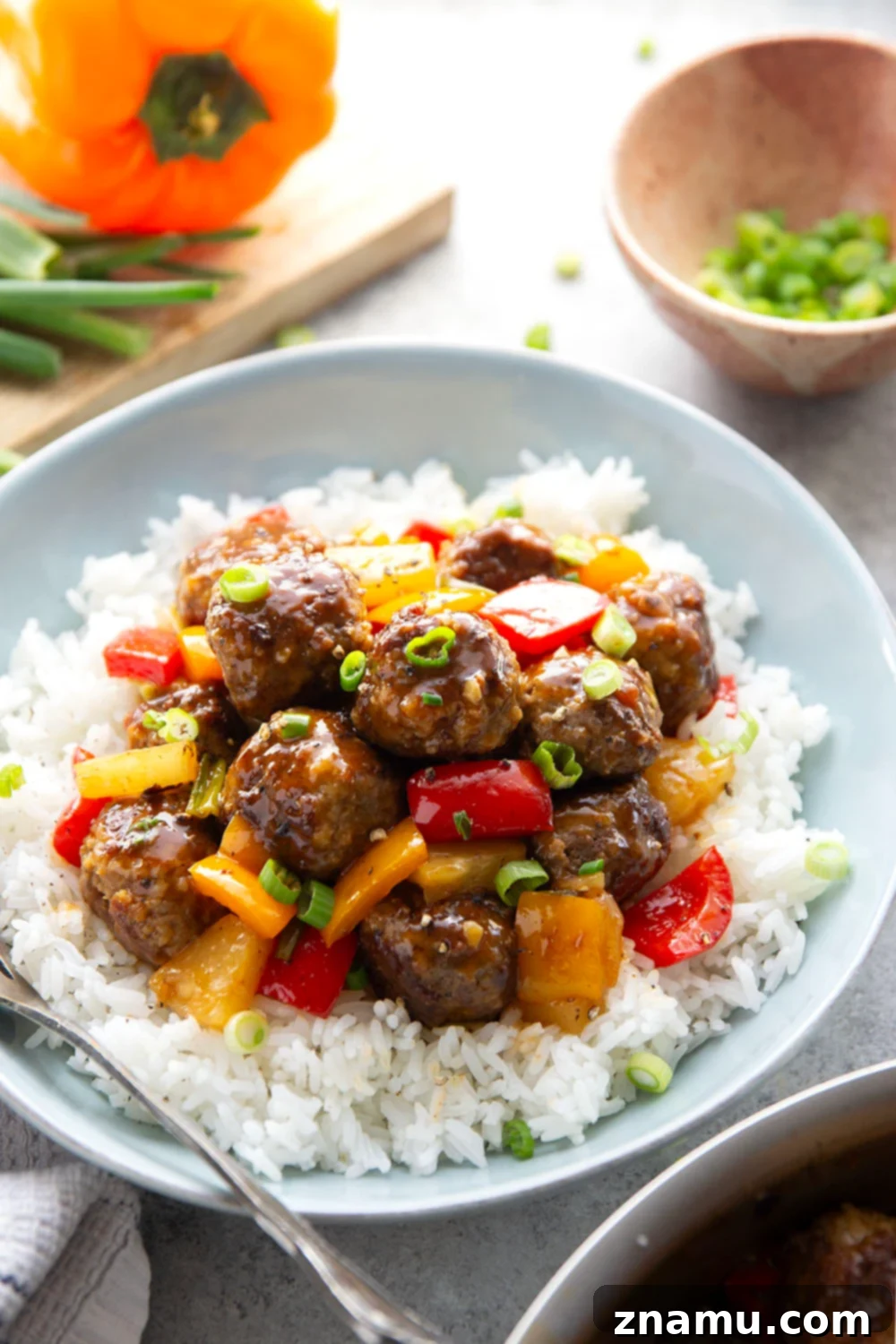 Glazed Meatballs with Peppers 6 A homemade sweet and sour sauce coats every inch of these juicy sweet and sour meatballs that cook up with colorful peppers and sweet pineapple all in one pan.