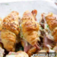 Melted Gruyere Ham Croissant Sliders 8 Gooey gruyere cheese, sliced deli ham, and a chive honey mustard spruce up classic ham and cheese croissant sliders into a winning appetizer that will disappear within minutes every time!