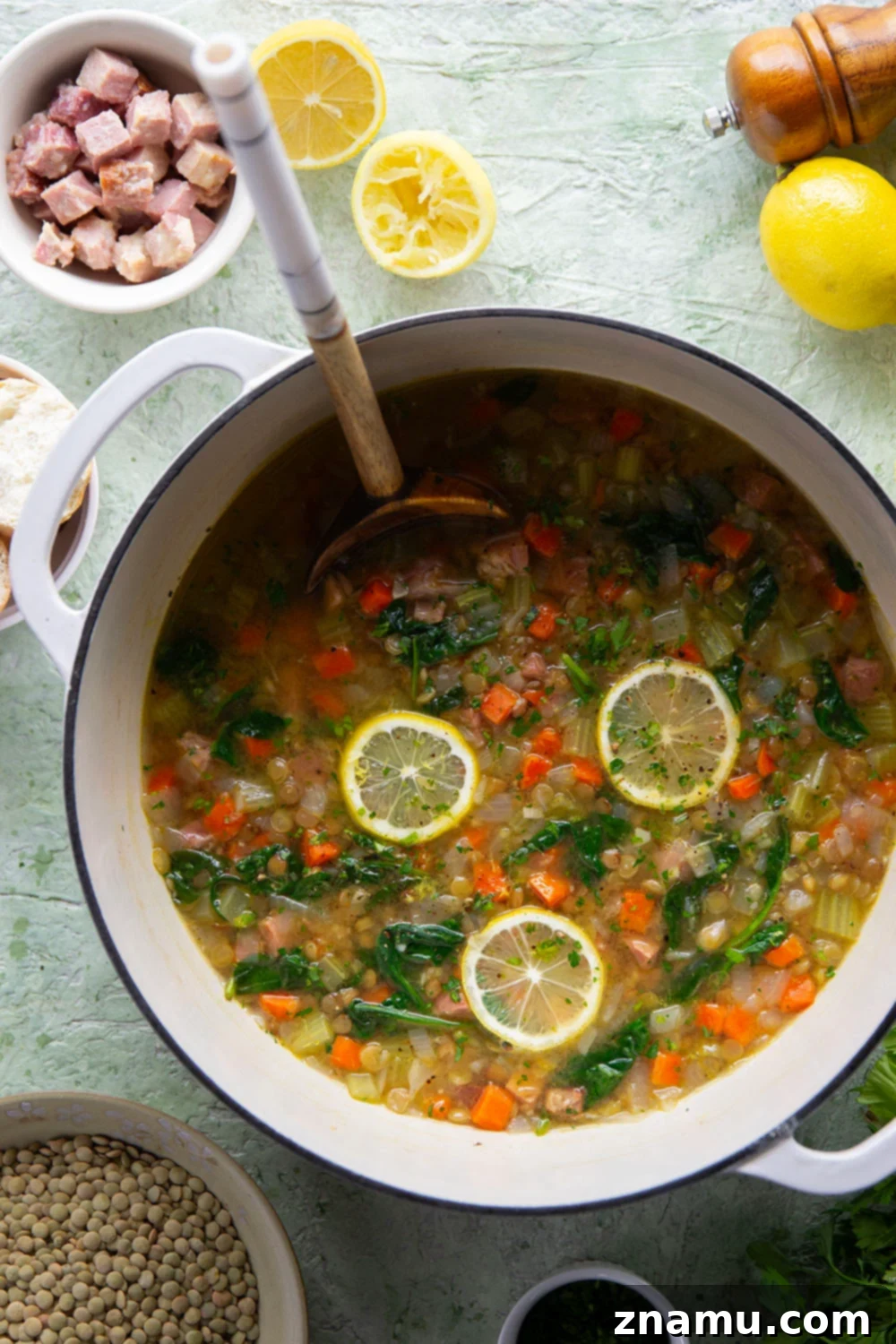 Hearty Lemon Lentil and Ham Soup 3 Overhead view of a pot of Lemon Lentil Ham Soup simmering on the stove.