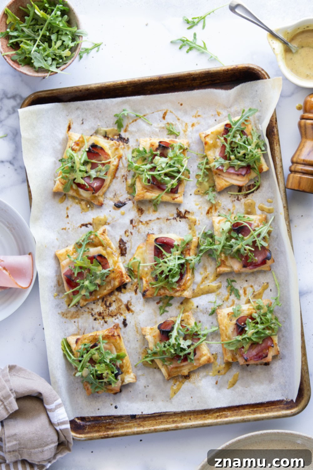 Flaky Chicken Cordon Bleu Tartlets 3 These savory cordon bleu puff pastry tarts have everything you'll find in the classic chicken dish in hand-held tart form! These tarts feature layers of deli ham, chicken, and Swiss cheese slices with a tangy honey mustard and lots of arugula piled on top.