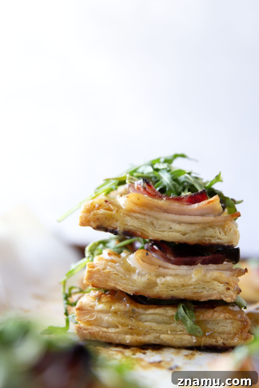 Flaky Chicken Cordon Bleu Tartlets 4 These savory cordon bleu puff pastry tarts have everything you'll find in the classic chicken dish in hand-held tart form! These tarts feature layers of deli ham, chicken, and Swiss cheese slices with a tangy honey mustard and lots of arugula piled on top.