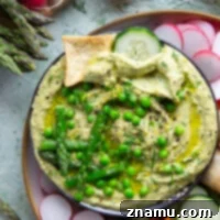 Emerald Asparagus Pea Hummus 8 Vibrant spring peas and asparagus are the best spring twist on hummus! This asparagus pea hummus is silky smooth and pairs wonderfully with fresh vegetables and pita chips for dipping.