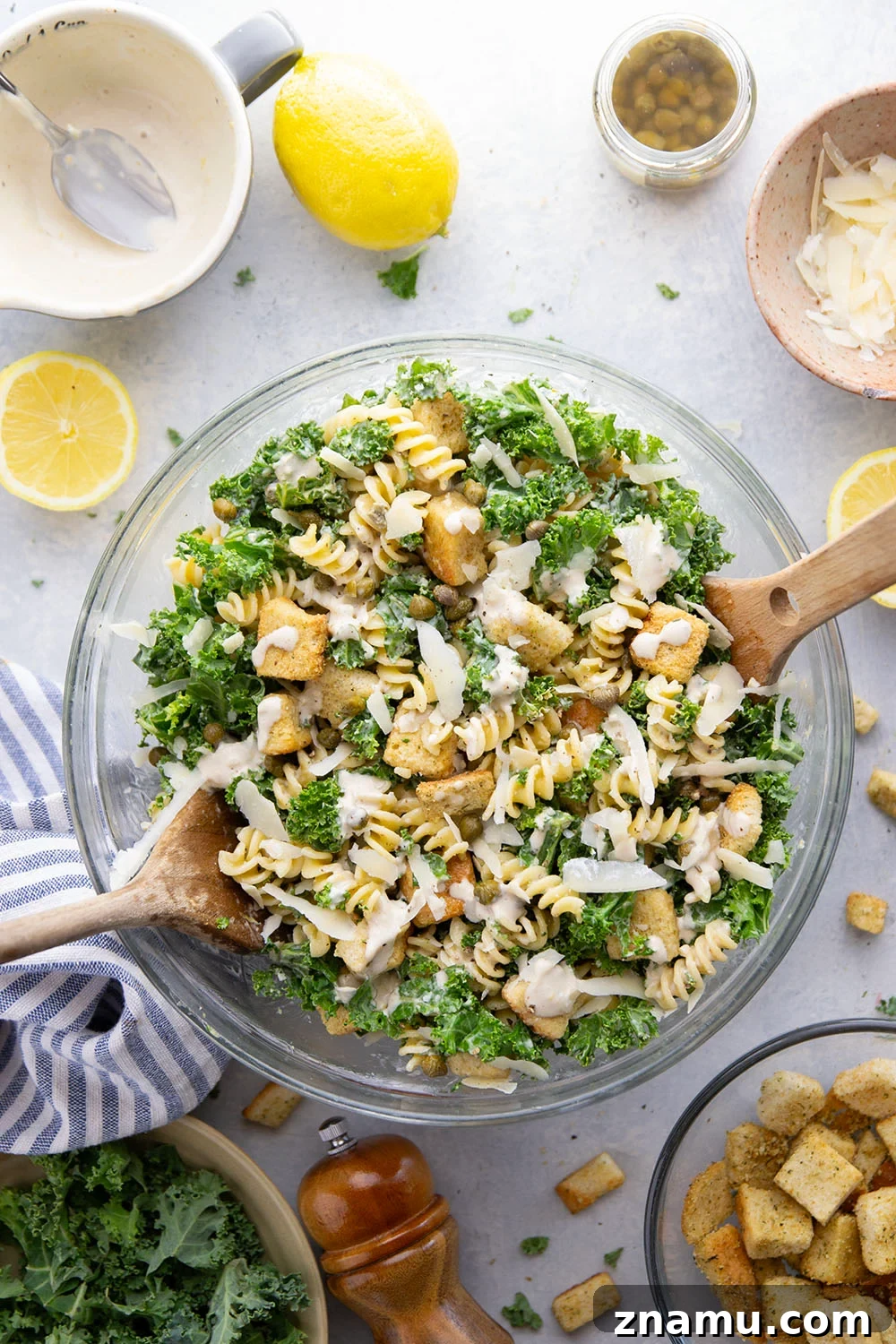 Creamy Lemon Kale Caesar Pasta Salad Recipe 2 Packed with tender chopped kale, pasta, and all the caesar salad works including a homemade lemon caesar dressing, this kale caesar pasta salad will soon be a cookout staple for the summer.