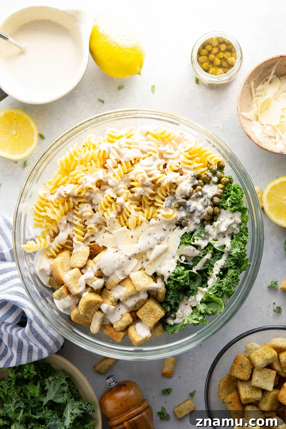 Creamy Lemon Kale Caesar Pasta Salad Recipe 3 Packed with tender chopped kale, pasta, and all the caesar salad works including a homemade lemon caesar dressing, this kale caesar pasta salad will soon be a cookout staple for the summer.