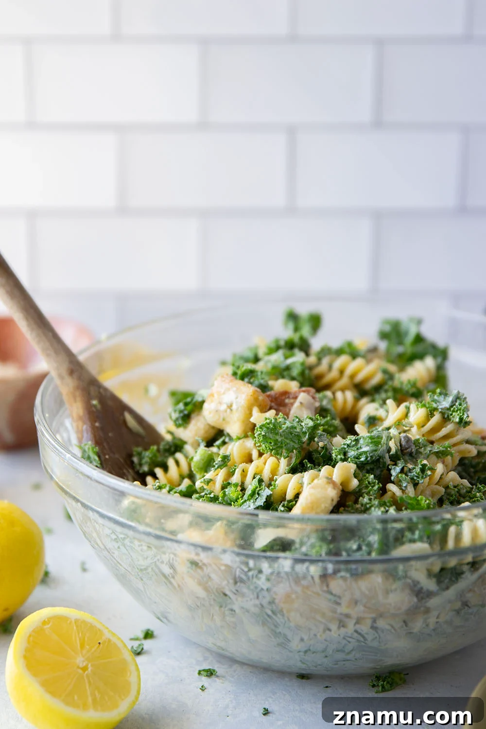 Creamy Lemon Kale Caesar Pasta Salad Recipe 4 Packed with tender chopped kale, pasta, and all the caesar salad works including a homemade lemon caesar dressing, this kale caesar pasta salad will soon be a cookout staple for the summer.
