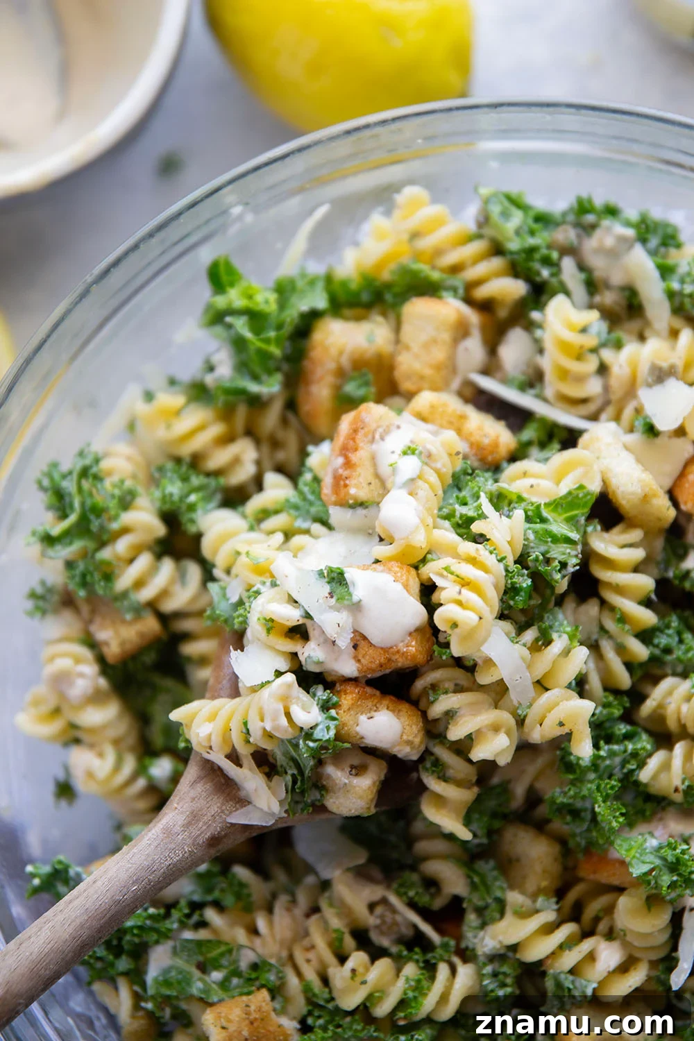 Creamy Lemon Kale Caesar Pasta Salad Recipe 6 Packed with tender chopped kale, pasta, and all the caesar salad works including a homemade lemon caesar dressing, this kale caesar pasta salad will soon be a cookout staple for the summer.