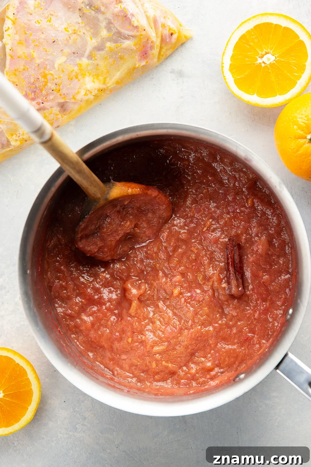 These grilled orange pork chops feature pork chops marinated in a fresh orange marinade, grilled until perfectly juicy, and served with a sweet and tangy rhubarb compote.