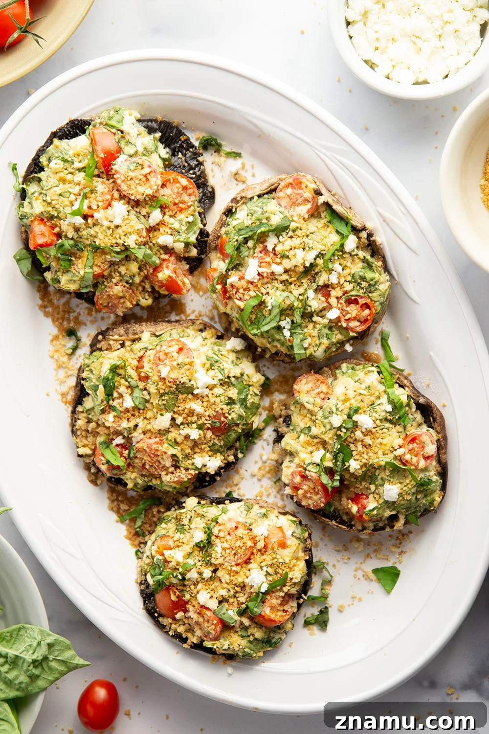 Grilled Portobello Mushrooms Stuffed with Herbed Goat Cheese 2 These stuffed portobello mushrooms include a fresh cherry tomato spinach feta filling stuffed into tender portobello caps and grilled for just a few minutes until perfectly tender and smoky.