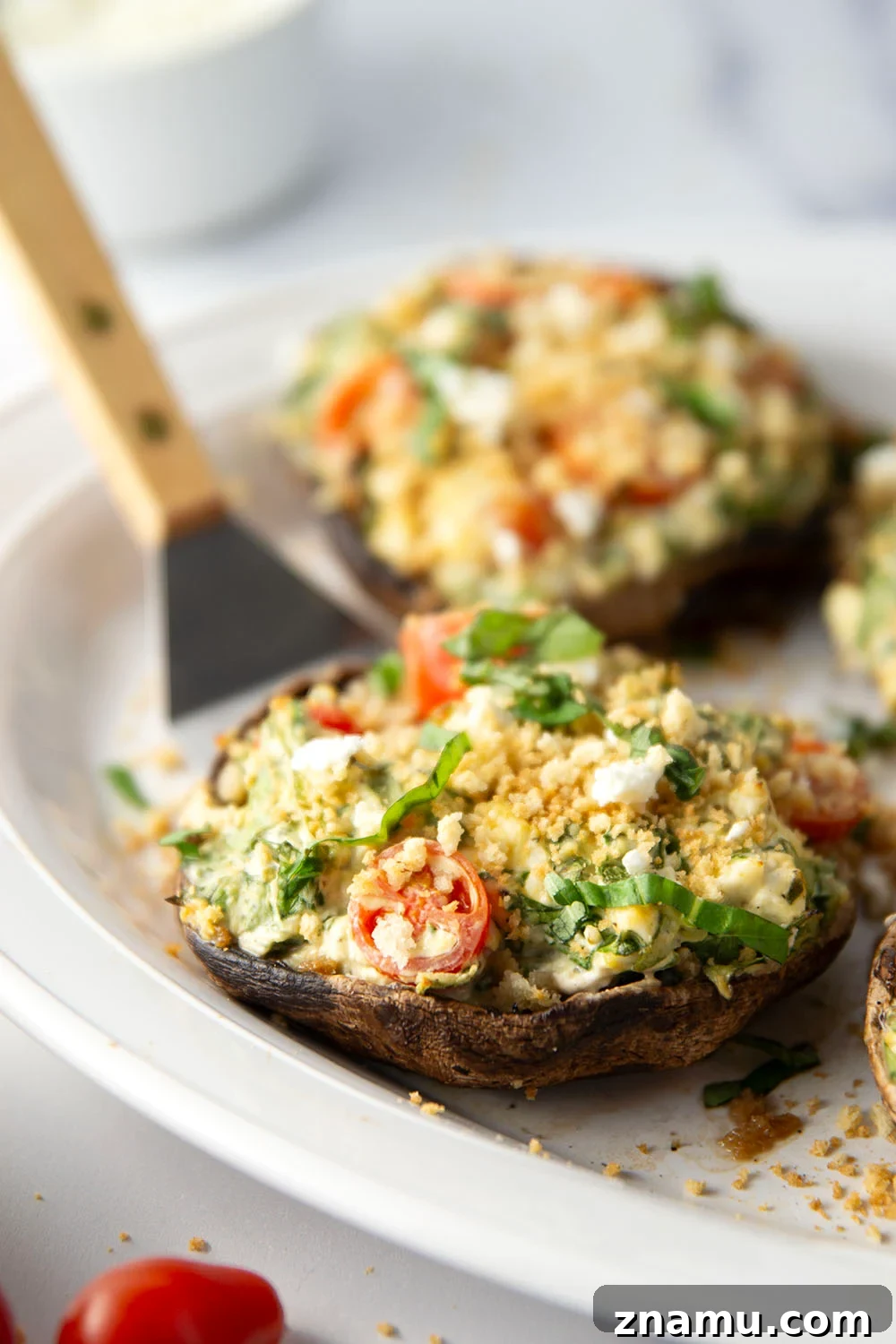 Grilled Portobello Mushrooms Stuffed with Herbed Goat Cheese 3 These stuffed portobello mushrooms include a fresh cherry tomato spinach feta filling stuffed into tender portobello caps and grilled for just a few minutes until perfectly tender and smoky.