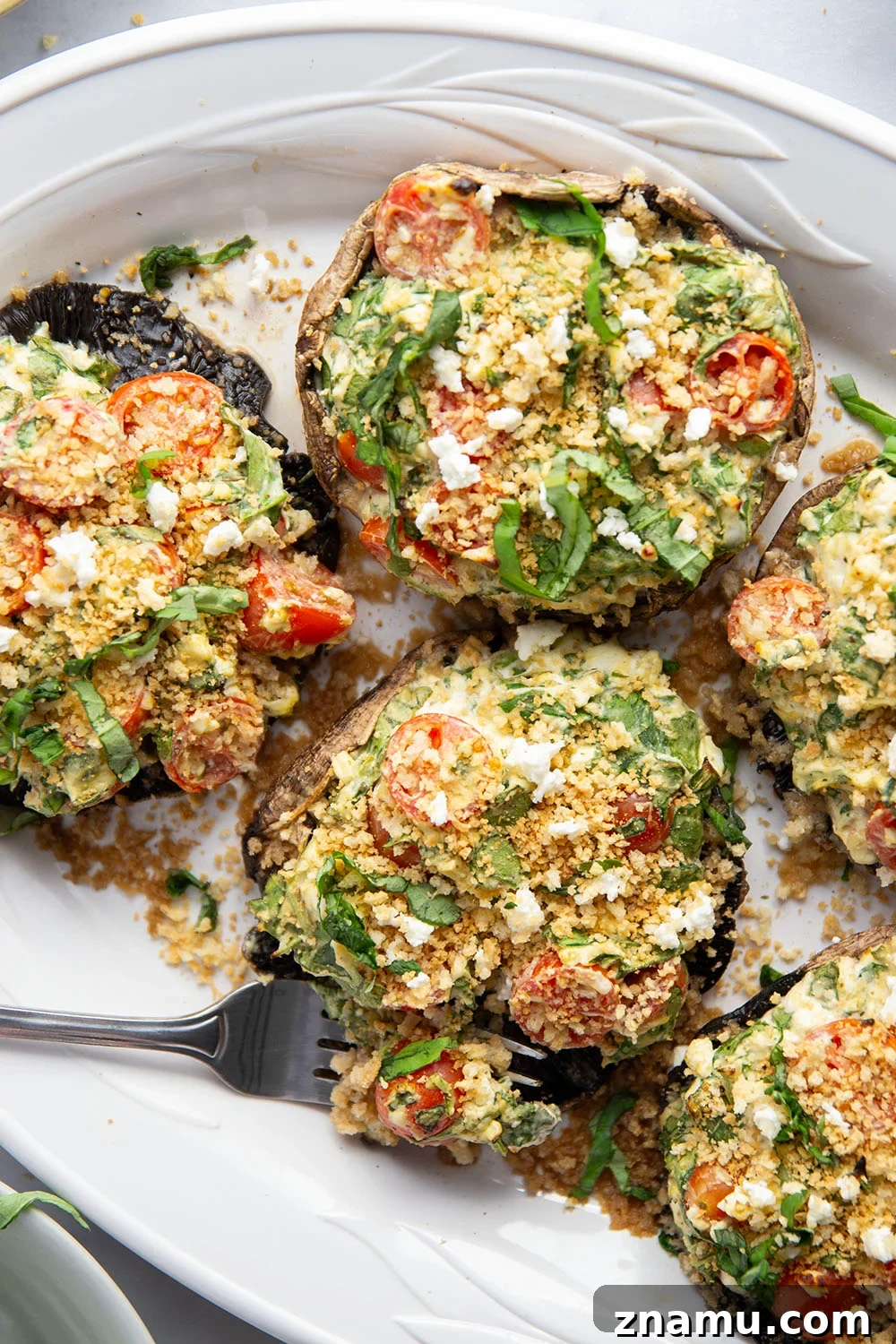 Grilled Portobello Mushrooms Stuffed with Herbed Goat Cheese 5 These stuffed portobello mushrooms include a fresh cherry tomato spinach feta filling stuffed into tender portobello caps and grilled for just a few minutes until perfectly tender and smoky.