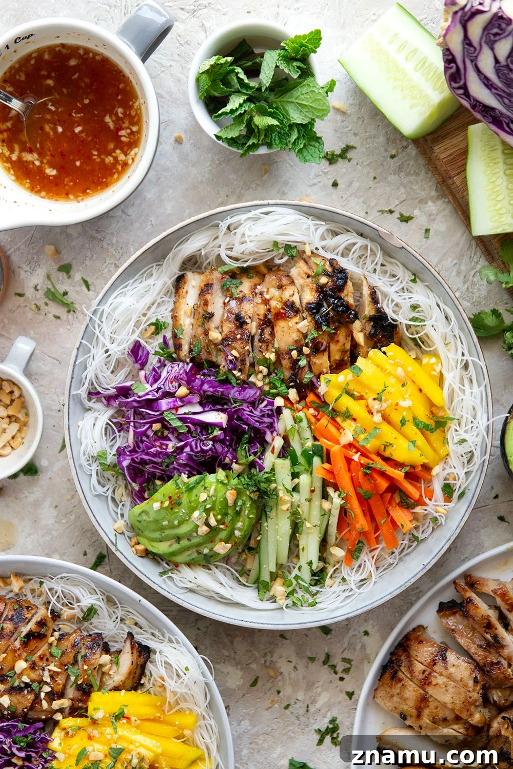 Lemongrass marinated grilled chicken and all the fresh spring roll ingredients collide in these colorful spring roll bowls. Easy to prep ahead for healthy lunches or dinners!
