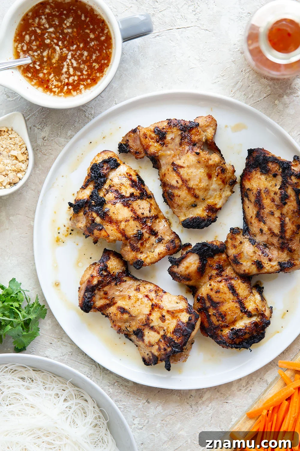 Lemongrass marinated grilled chicken and all the fresh spring roll ingredients collide in these colorful spring roll bowls. Easy to prep ahead for healthy lunches or dinners!
