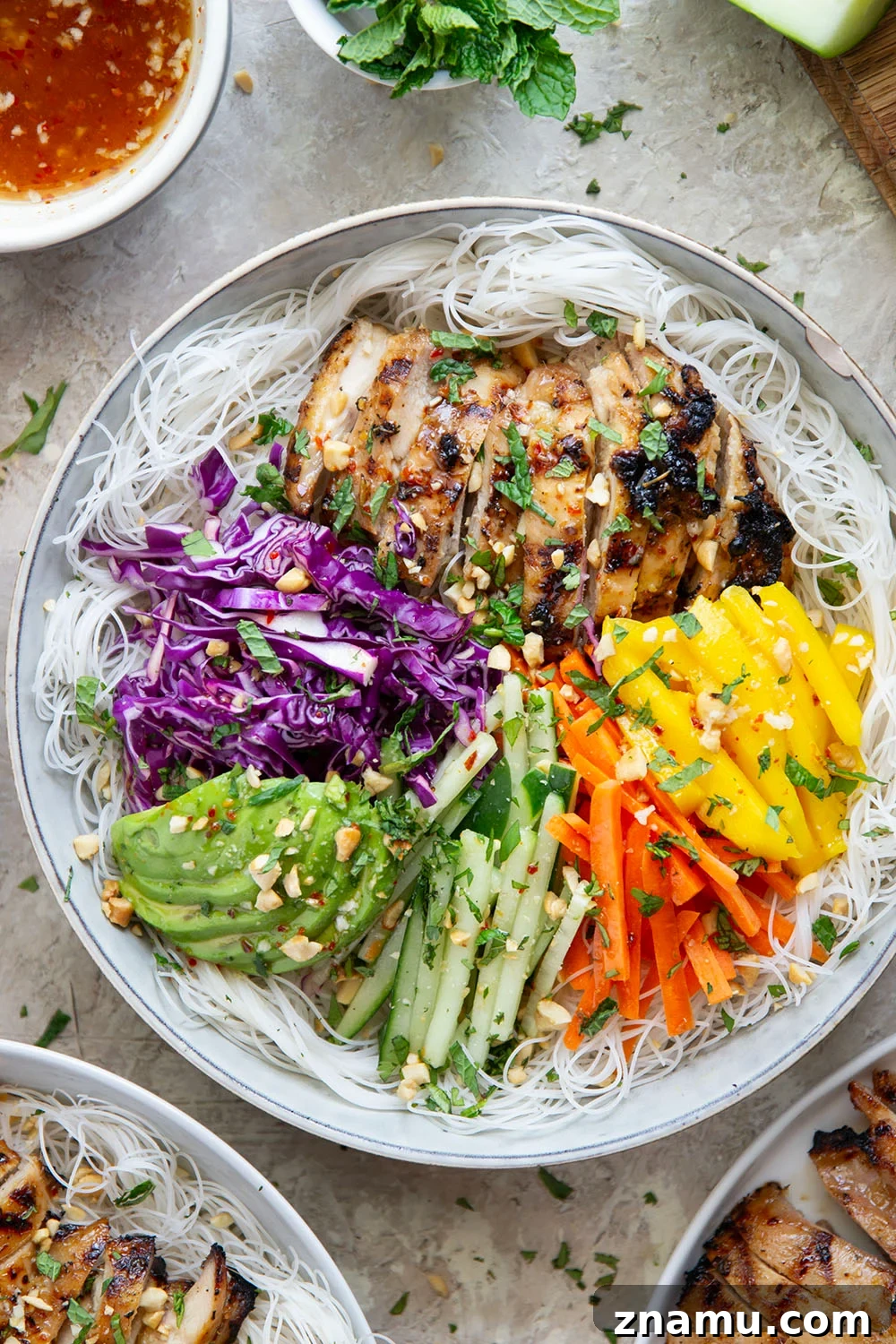 Lemongrass marinated grilled chicken and all the fresh spring roll ingredients collide in these colorful spring roll bowls. Easy to prep ahead for healthy lunches or dinners!