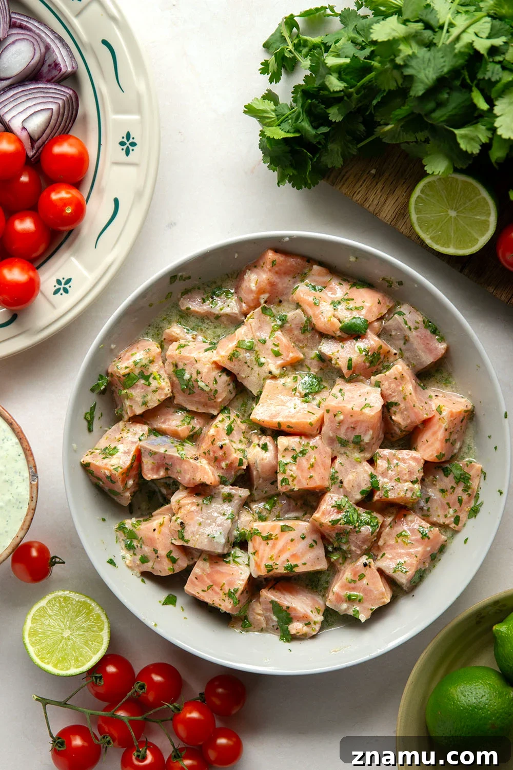 Cilantro-Lime Grilled Salmon Skewers for Summer BBQs 3 Marinated in a fresh cilantro lime sauce and grilled alongside red onion, cherry tomatoes, and served with a cilantro lime crema, these cilantro lime grilled salmon kabobs are a quick dinner to throw on the grill for any occasion.
