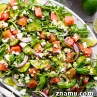 Sweet watermelon, tangy feta, and crisp cucumbers are the best salad combo in this watermelon feta cucumber salad that gets dressed in a fresh basil lime dressing and goes well with any summer meal.