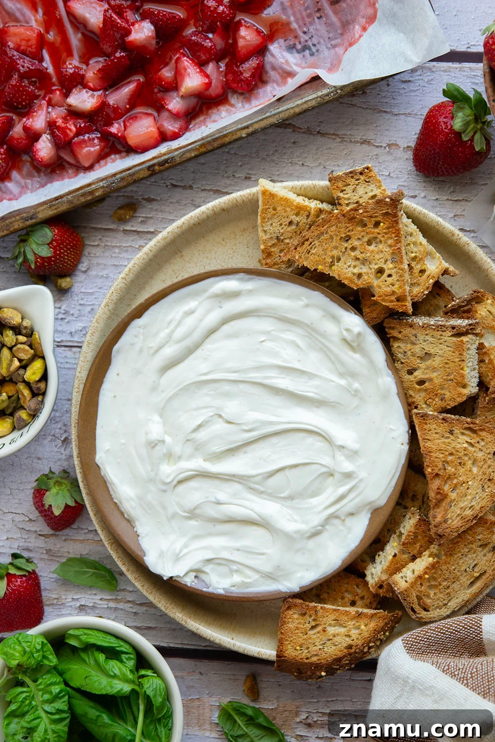 Whipped Goat Cheese with Honey-Roasted Strawberries Recipe 4 Silky whipped goat cheese is topped with juicy honey roasted strawberries and incredible served with crostini for dipping.